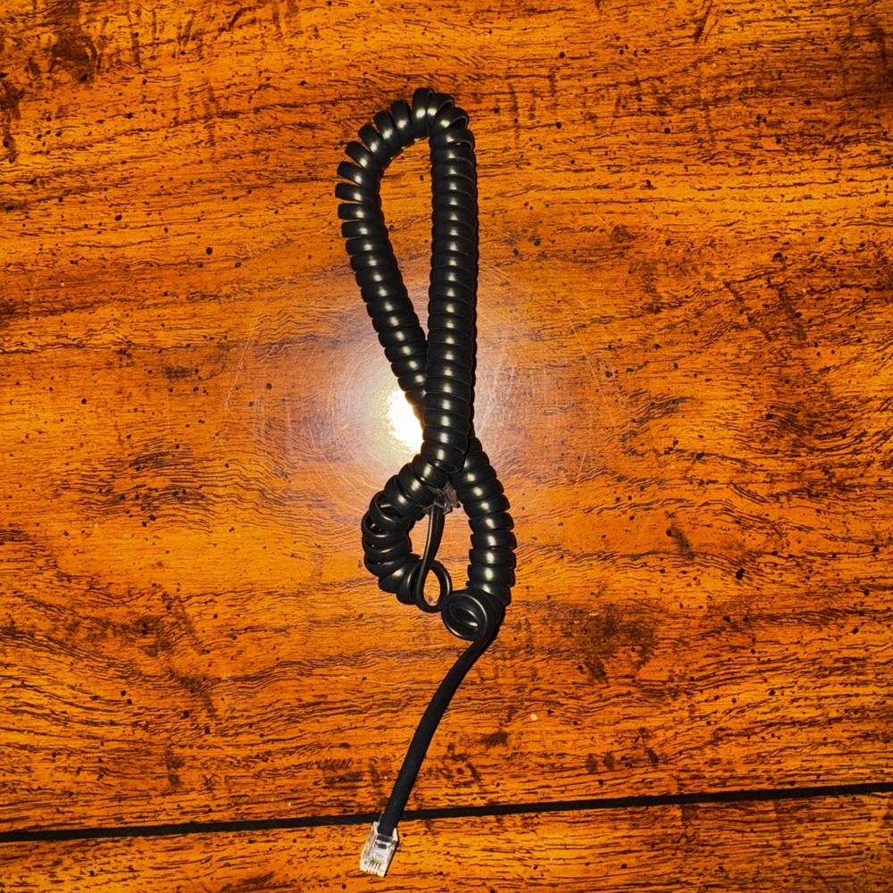 Black VoIP Phone Adapter for Enhanced Networking